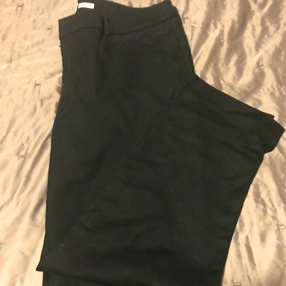 Black women’s cigarette style dress pants.